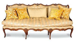 A Louis XV Style Walnut Canape Height 41 x width 83 1/2 x depth 29 inches.