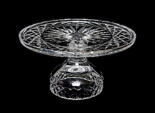 A Pressed Glass Cake Stand Height 5 1/4 x diameter 10 inches.