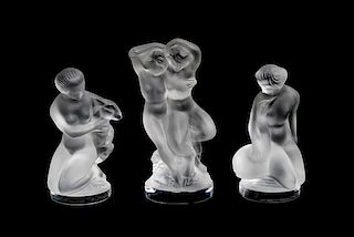 Three Lalique Molded and Frosted Glass Figures Height 9 inches.
