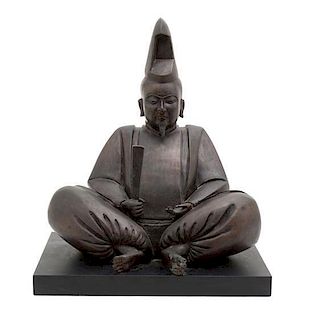 A Japanese Bronzed Metal Figure of a Priest Height overall 14 1/2 inches.