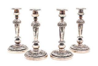 A Set of Four Rococo Style Silver Plate Candlesticks Height 10 1/2 inches.