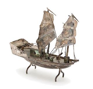 A Miniature Silver Model of a Boat Width 3 inches.