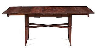 An Art Deco Style Mahogany Extension Table Height 29 1/4 x width 38 1/2 x length 69 3/8 inches.