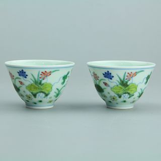 Pair of Chinese famille verte porcelain cups, Yongzheng mark. 