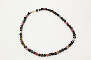 Gemstone bead necklace with 14K gold clasp.