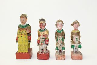 A group of four Chinese wood figurines