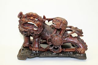 Chinese carved hard wood statue of foo dogs.
