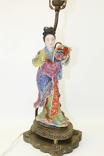 Chinese famille rose porcelain statue of a lady.