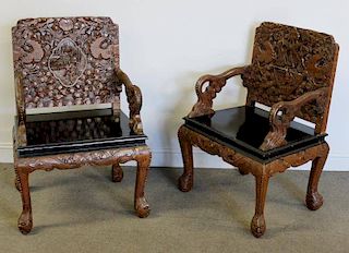 Pair of Highly Carved Asian Hardwood Arm Chairs.