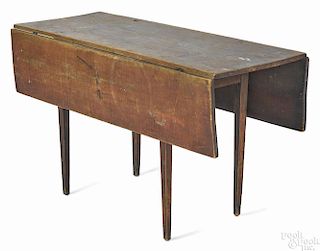 New England pine dropleaf work table, ca. 1820, retaining an old red surface, 27'' h., 47 3/4'' w.
