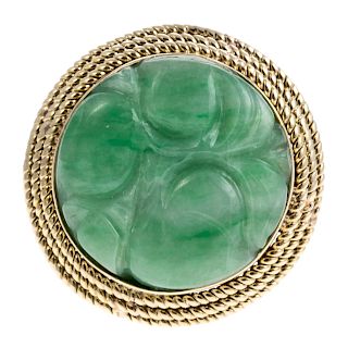 A Ladies Carved Green Jade Ring in 14K