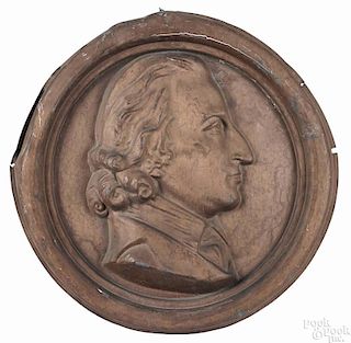 Pair of painted zinc portrait medallions, one likely George Washington, 19th c., 21'' dia.