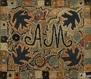 American hooked rug, ca. 1900, monogrammed A.M., 26'' x 30''.