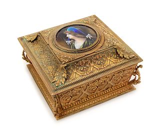 * A Limoges Enameled Medallion in a French Gilt Metal Table Casket Width of casket 7 1/4 inches.