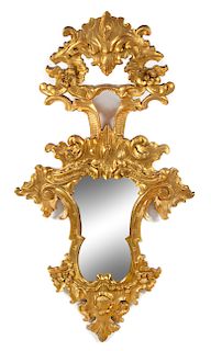 An Italian Baroque Style Giltwood Mirror Height 51 x width 27 inches.