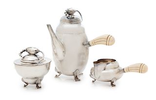 A Silver Three-Piece Tea Service, Maker's Mark Unknown, 20th Century, in the style of Georg Jensen's Blossom pattern, comprising