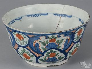Dutch Delft tin glazed earthenware punch bowl, mid 18th c., with polychrome floral decoration