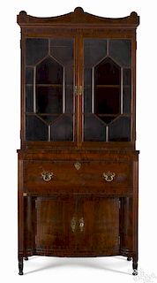 Philadelphia Sheraton mahogany secretary, ca. 1810, the upper section with an arched crest