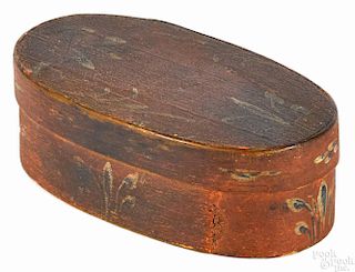 Painted bentwood band box, 19th c., having blue and white floral sprays on a salmon background