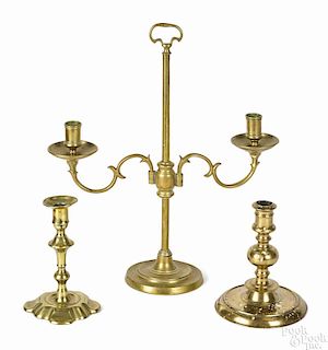Dutch brass two-arm candelabrum, 18th c., 17 1/2'' h., together with a single Dutch brass candlestick