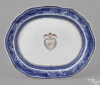 Chinese export porcelain platter, ca. 1800, with a blue butterfly border and a central shield with