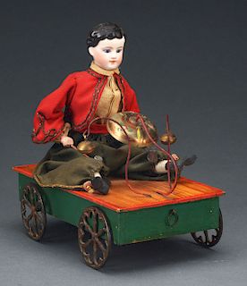 Seated Child on Wheeled Platform Bell Toy.