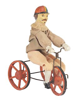 Wooden Man Riding On A Tricycle. 