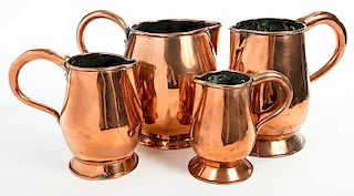 Four British Graduated Copper Beer Jugs