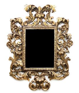 A Rococo Style Giltwood Mirror, Height 62 x width 47 inches.
