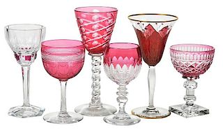 Six Assorted Cranberry Cut Glass Stems