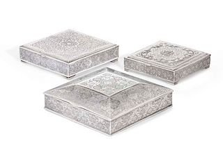 Three Persian silver cigarette boxes