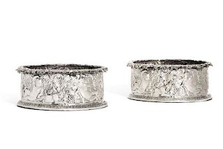 A pair of sterling silver magnum wine coasters