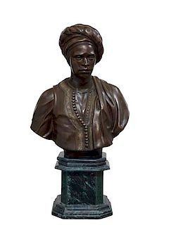 A patinated bronze bust of a Moor on marble base