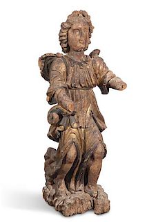 A Spanish Baroque carved wood figure of a saint