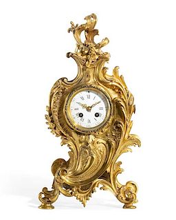 A Louis XV style gilt bronze mantel clock