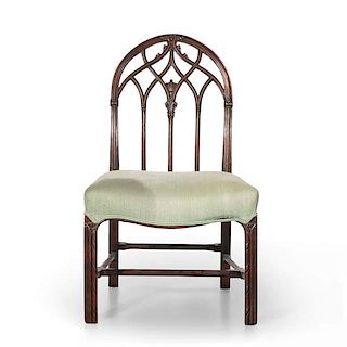 A Gothic Revival carved mahogany side chair