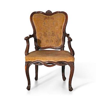 An Italian Rococo walnut and needlework armchair
