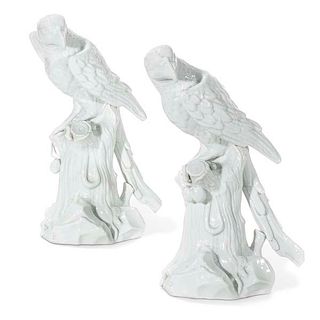 A pair of French porcelain models of parrots, Samson