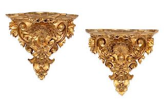 A pair of Louis XV style giltwood wall brackets