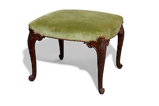 A George II upholstered mahogany stool