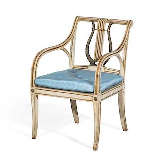 A Regency white painted and parcel gilt armchair