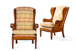 A near pair of Continental  wood wing armchairs