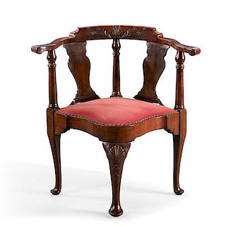 A George II carved mahogany corner armchair