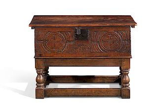 A Charles II carved oak bible box on stand