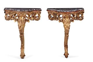 A pair of Italian Rococo style giltwood consoles