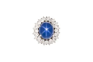 A 22 carat star sapphire, diamond & platinum ring