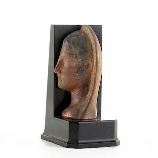 An Etruscan painted terracotta votive head