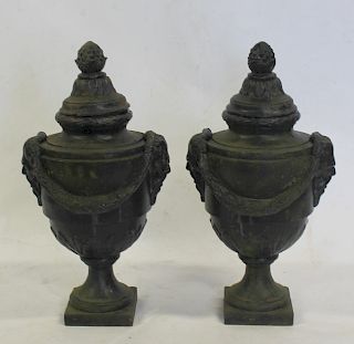 Pair of Black Painted Lidded Cast Iron Urns.