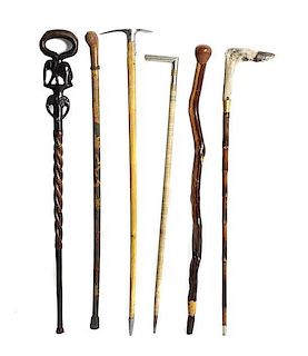A Collection of Six Walking Sticks, Length of longest 36 inches.