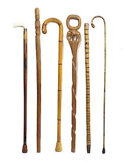 Collection of Six Walking Sticks, Length of longest 36 3/4 inches.